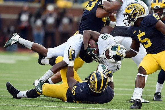 Chris Wormley (43), Jabrill Peppers (5), and Royce Jenkins-Stone (52)