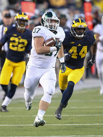 Jarrod Wilson (22) and Delano Hill (44)