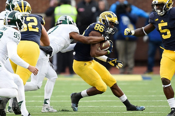 Mason Cole (52), Jehu Chesson (86), and Jabrill Peppers (5)