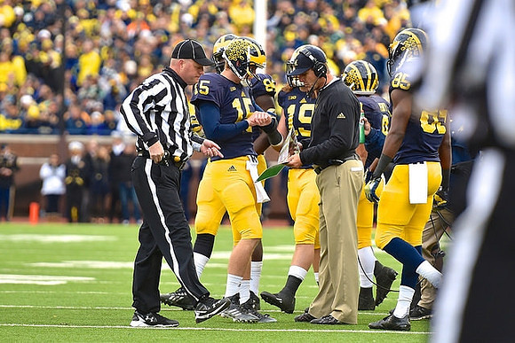 Jake Rudock (15), Jehu Chesson (86), Jim Harbaugh, Henry Poggi (19), and Maurice Ways (85)