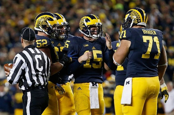 Mason Cole (52), Kyle Kalis (67), Jake Rudock (15), and Ben Braden (71)