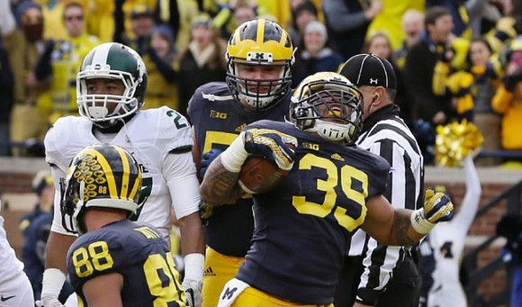 Jake Butt (88), Mason Cole (52), and Sione Houma (39)