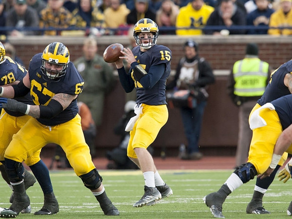 Erik Magnuson (78), Kyle Kalis (67), and Jake Rudock (15)