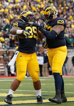 Sione Houma (39) and Mason Cole (52)