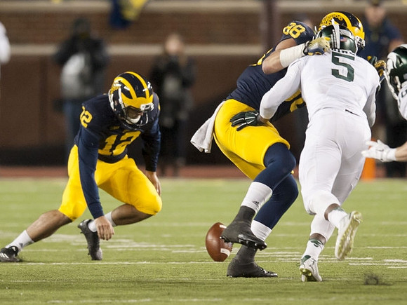 Blake O'Neill (12) and Jake Butt (88)