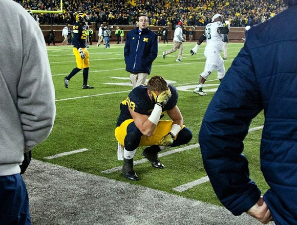 Wayne Lyons (24) and Jake Butt (88)