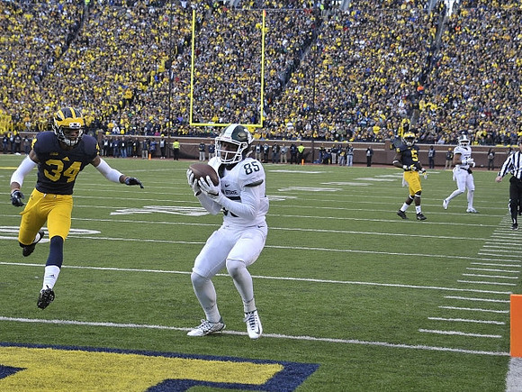 Jeremy Clark (34) and Jabrill Peppers (5)