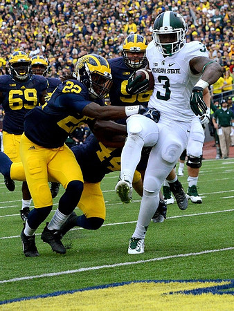 Willie Henry (69), Jarrod Wilson (22), Delano Hill (44), and Ryan Glasgow (96)