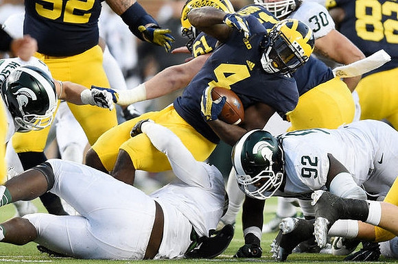Graham Glasgow (61) and De'Veon Smith (4)