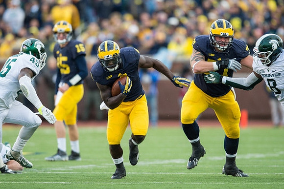 Jake Rudock (15), De'Veon Smith (4), and Ben Braden (71)