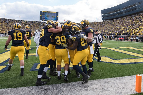 Henry Poggi (19), Jake Butt (88), Sione Houma (39), Derrick Green (27), and Ben Braden (71)