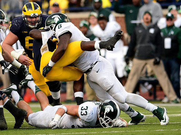 Graham Glasgow (61) and De'Veon Smith (4)