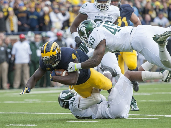 De'Veon Smith (4) and Ben Braden (71)