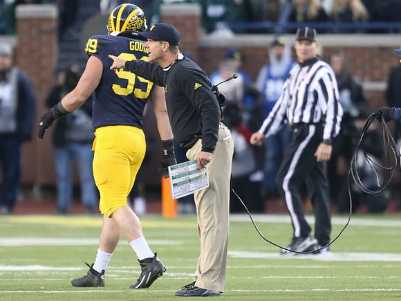 Matthew Godin (99) and Jim Harbaugh