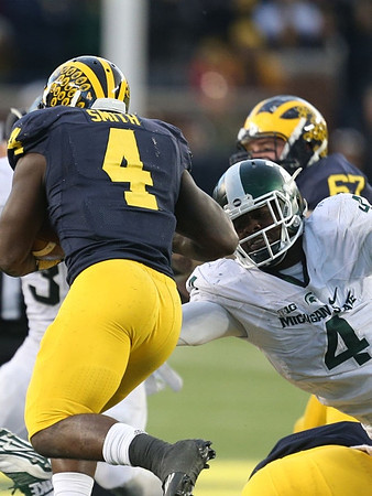 De'Veon Smith (4) and Kyle Kalis (67)