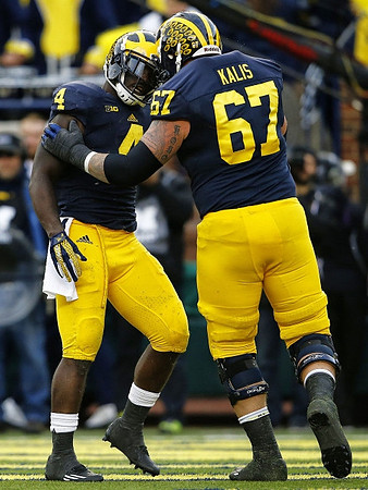 De'Veon Smith (4) and Kyle Kalis (67)