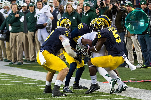 Desmond Morgan (3), Jourdan Lewis (26), and Jabrill Peppers (5)