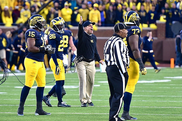 James Ross (15), Jourdan Lewis (26), Jim Harbaugh, and Maurice Hurst (73)