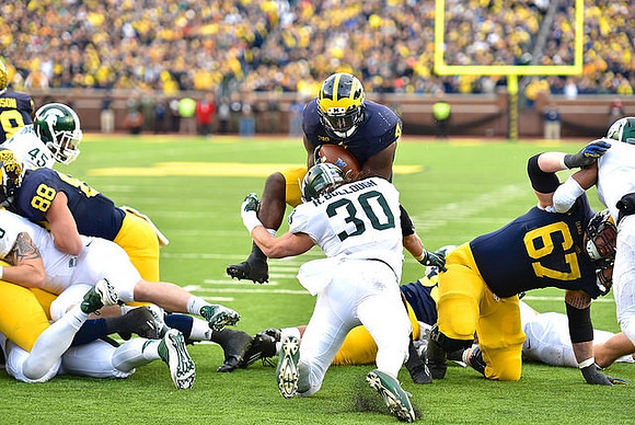 Jake Butt (88), De'Veon Smith (4), and Kyle Kalis (67)