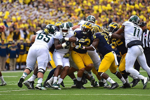 Desmond Morgan (3) and Jabrill Peppers (5), and Royce Jenkins-Stone (52)
