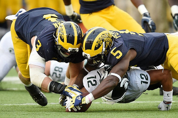 Desmond Morgan (3) and Jabrill Peppers (5)