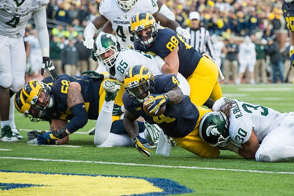Mason Cole (52), De'Veon Smith (4), and Jake Butt (88)