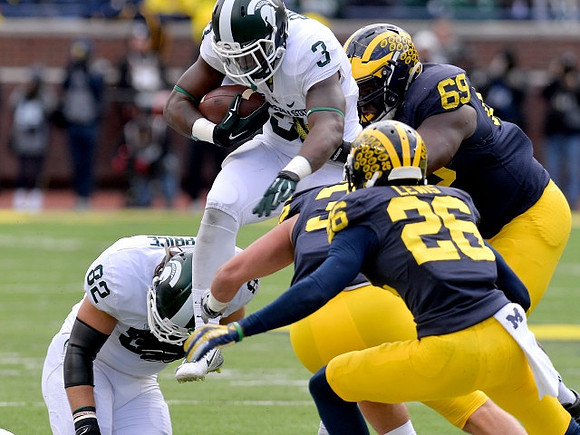 Jourdan Lewis (26), Joe Bolden (35), and Willie Henry (69)