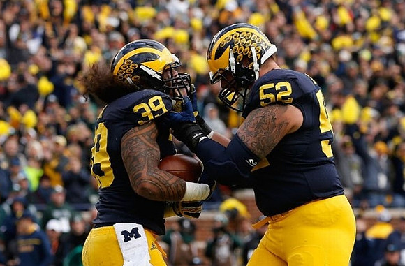 Sione Houma (39) and Mason Cole (52)