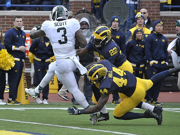 Delano Hill (44) and Jarrod Wilson (22)