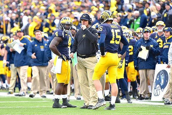 De'Veon Smith (4), Jim Harbaugh, and Jake Rudock (15)
