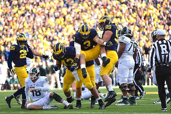 Dymonte Thomas (25), Chris Wormley (43), Desmond Morgan (3), and Matthew Godin (99)
