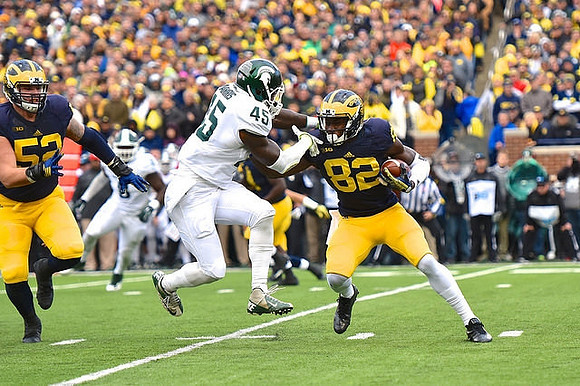 Mason Cole (52) and Amara Darboh (82)