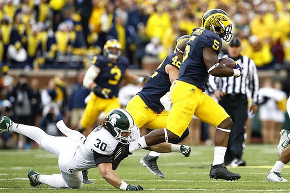 Desmond Morgan (3), Ben Gedeon (42), and Jabrill Peppers (5)
