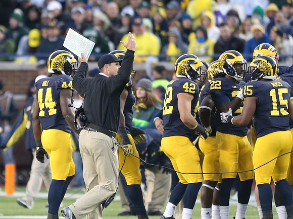 Delano Hill (44), Jim Harbaugh, Ben Gedeon (42), Jarrod Wilson (22), and James Ross (15)