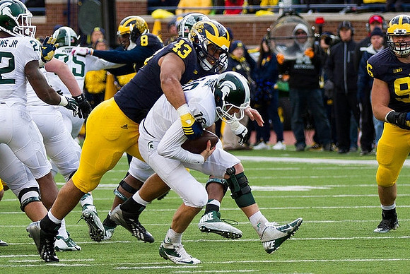 Channing Stribling (8), Chris Wormley (43), and Ryan Glasgow (96)