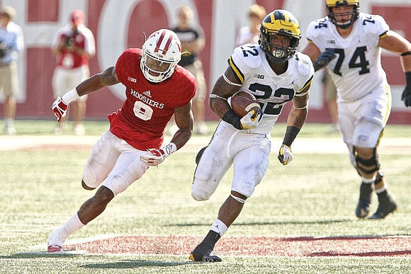 Karan Higdon (22) and Ben Bredeson (74)