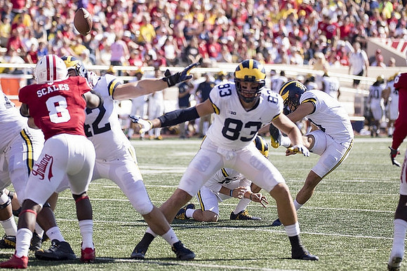 Mason Cole (52), Zach Gentry (83), Garrett Moores (15), and Quinn Nordin (3)
