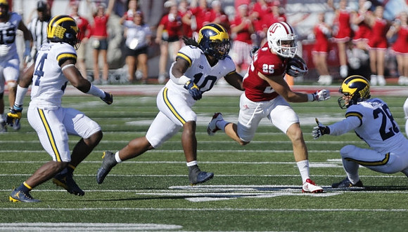 Josh Metellus (14), Devin Bush (10), and Brandon Watson (28)