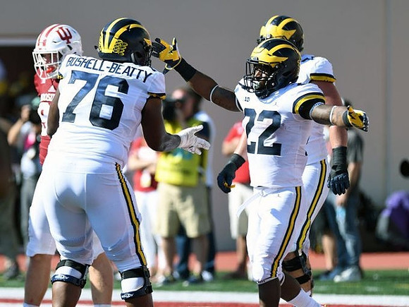 Juwann Bushell-Beatty (76) and Karan Higdon (22)
