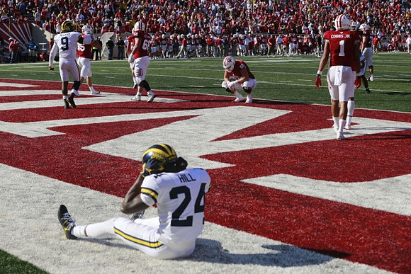 Mike McCray (9) and Lavert Hill (24)
