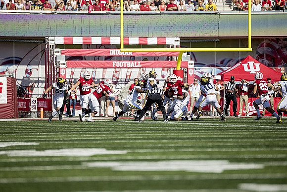 Noah Furbush (59), Rashan Gary (3), and Devin Bush (10)