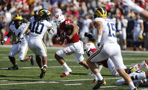 Josh Metellus (14), Devin Bush (10), Chase Winovich (15), and Mike McCray (9)