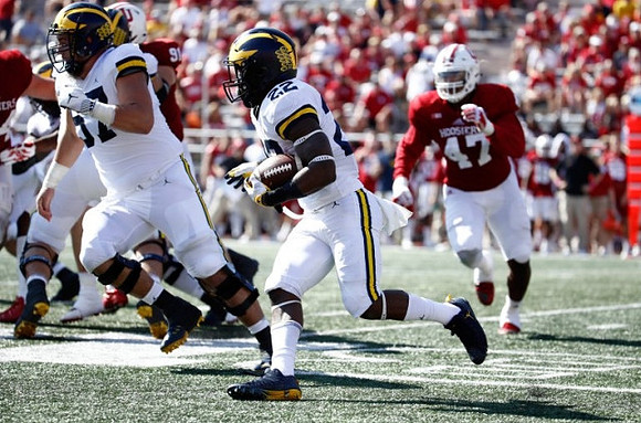 Patrick Kugler (57) and Karan Higdon (22)