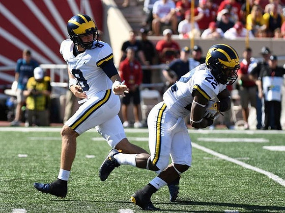 John O'Korn (8) and Karan Higdon (22)