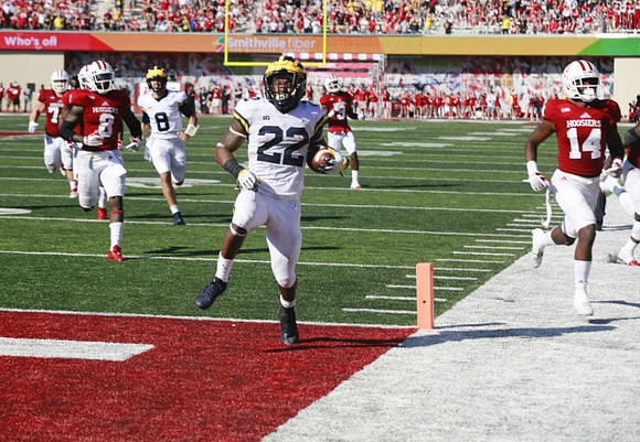 Karan Higdon (22) and John O'Korn (8)