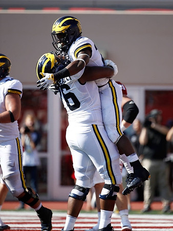Juwann Bushell-Beatty (76) and Karan Higdon (22)