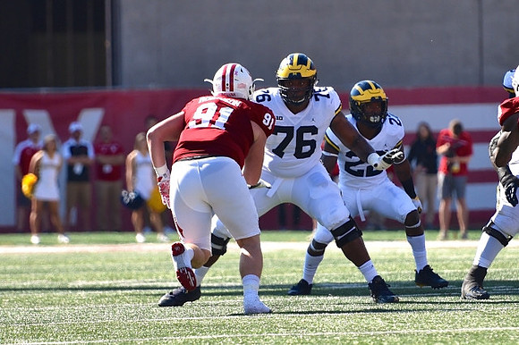 Juwann Bushell-Beatty (76) and Karan Higdon (22)