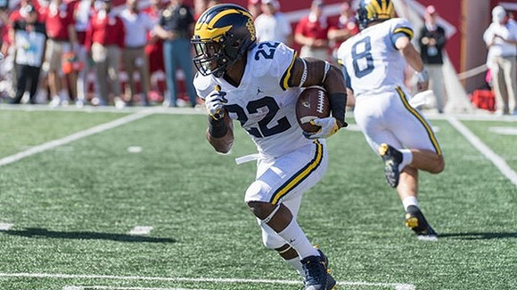 Karan Higdon (22) and John O'Korn (8)