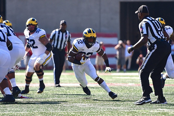 Juwann Bushell-Beatty (76), Mason Cole (52), Karan Higdon (22), and Tyrone Wheatley Jr. (17)