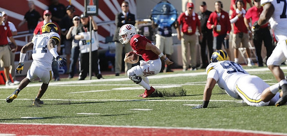 Josh Metellus (14) and Bryan Mone (90)
